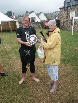 Leigh Gething of Bude Canoe Club being presented with BCHS Shield by  Audrey Wheatley