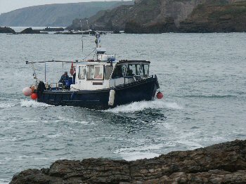 "Nancy Ann" rounding Chapel Rock entrance to Bude Harbour