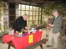 Bryan Dudley Stamp manning the raffle stall, with member Michael Westall, at the barge workshop