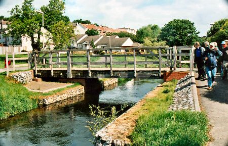 Walkers inspecting the new pedestrian bridge on the Tavistock Canal 19th May 2007.